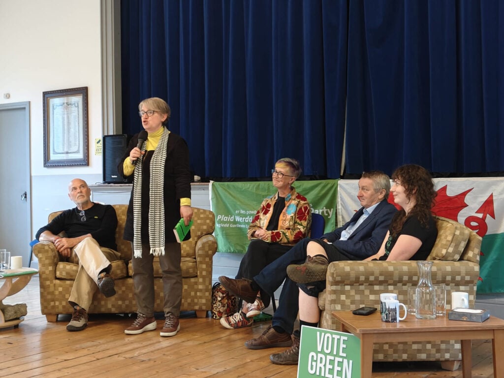  2 seperate sofas with a chair of the meeting sat inbetween. 

On the left sofa is Martin Schwaller and Natalie Bennet and on the right sofa is Anthony Slaughter and Harriet King